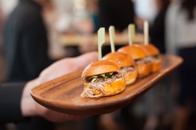 Platter with tiny burgers with pulled meat